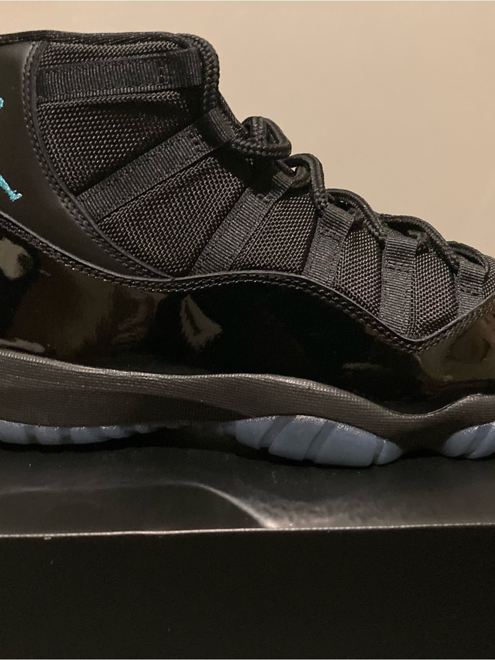 Jordan Men’s Retro 11 High-Top Sneakers in Black and Light Blue